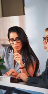 Professionals collaborating in a modern coworking space at Oh My Desk, Dubai